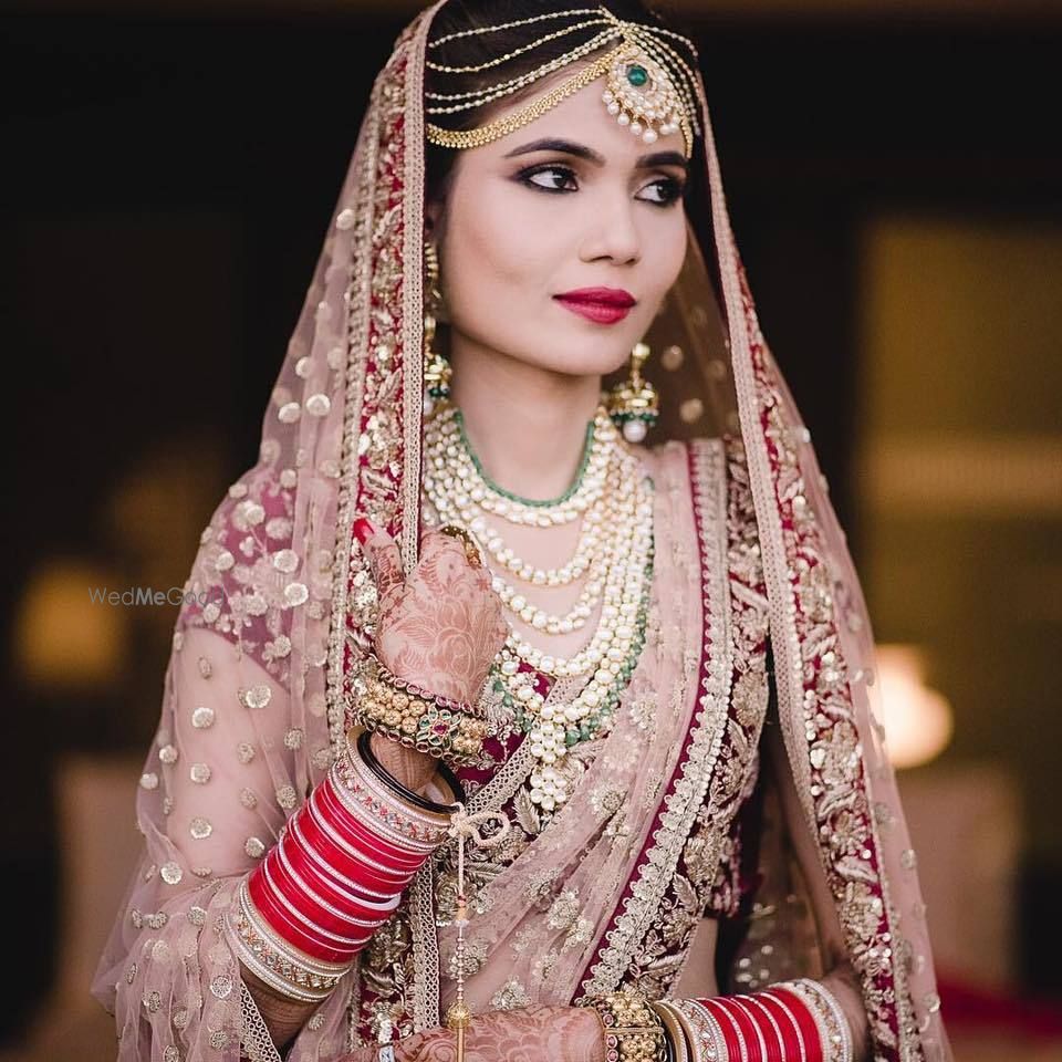 Photo of Offbeat bridal lehenga in light pink and marsala