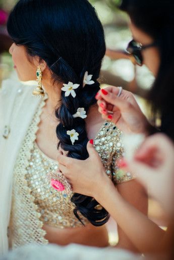 Photo of Side braid with white flowers for mehendi