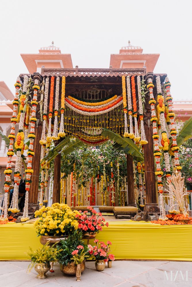 Photo of pretty south indian mandap decor idea with lots of floral strings