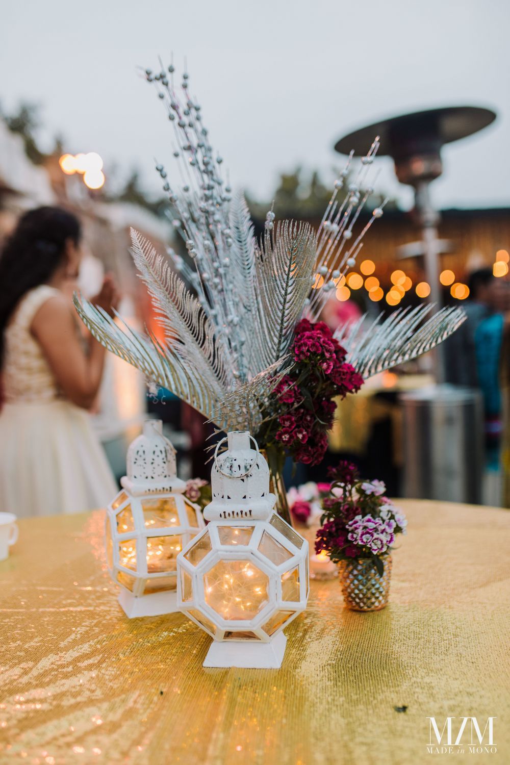 Photo of dry floral table centrepiece idea with lanterns