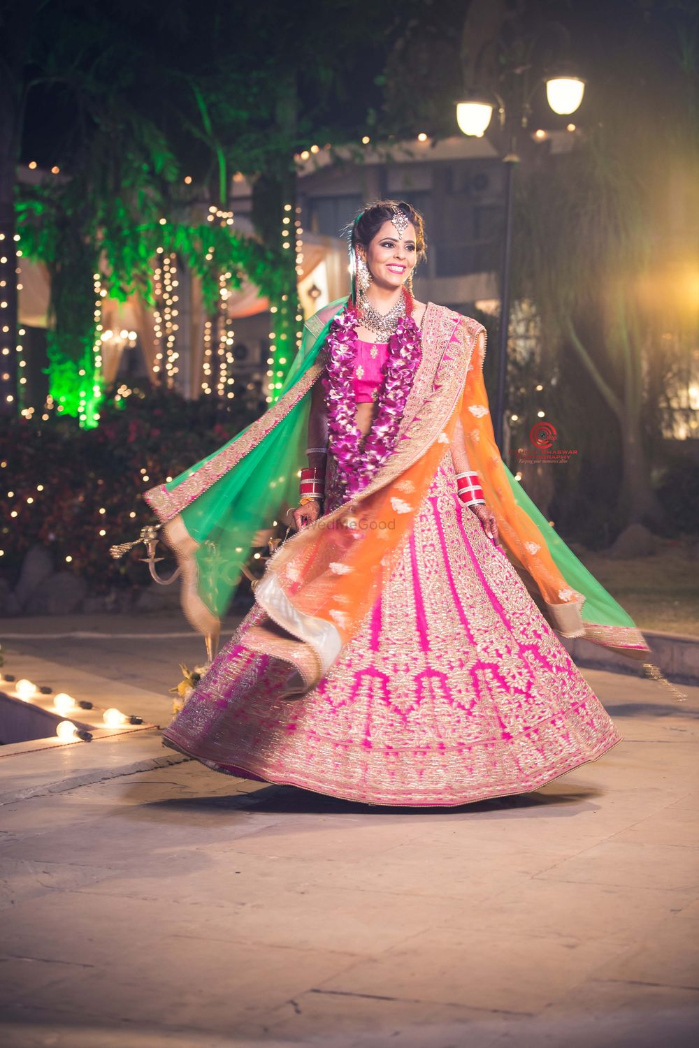 Photo of Hot Pink, Orange and Green Twirling Lehenga