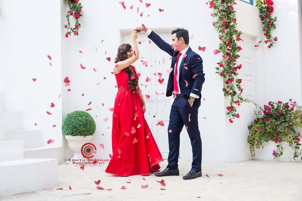 Photo of Couple Dancing Pre Wedding Shot with Rose Petal Shower