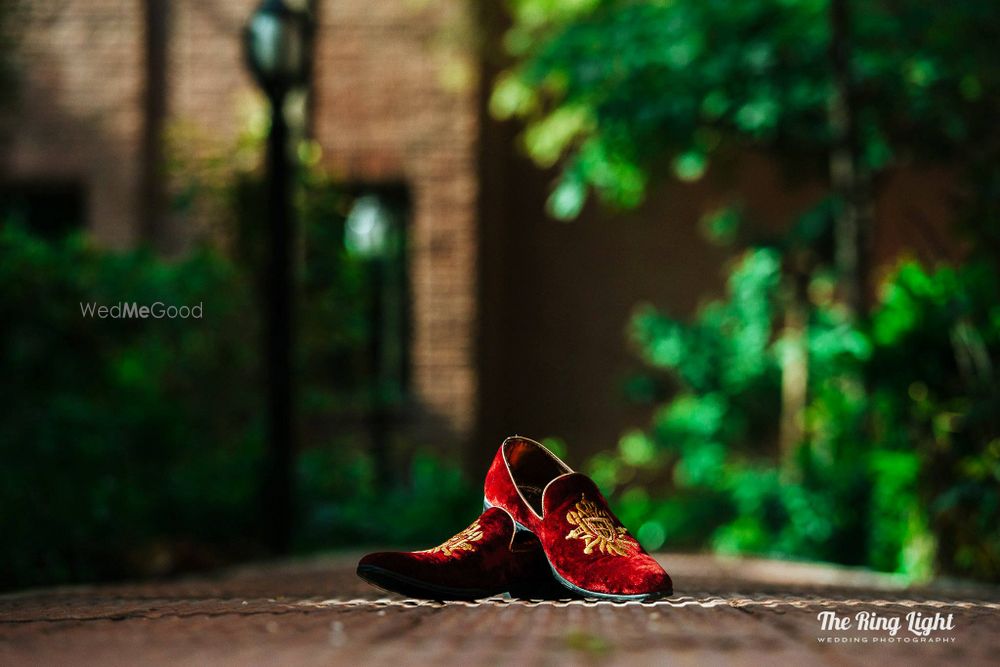 Photo of Maroon groom juttis in velvet