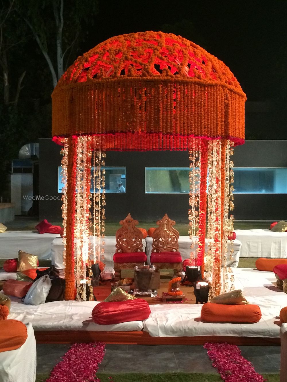 Photo of orange genda flower small mandap