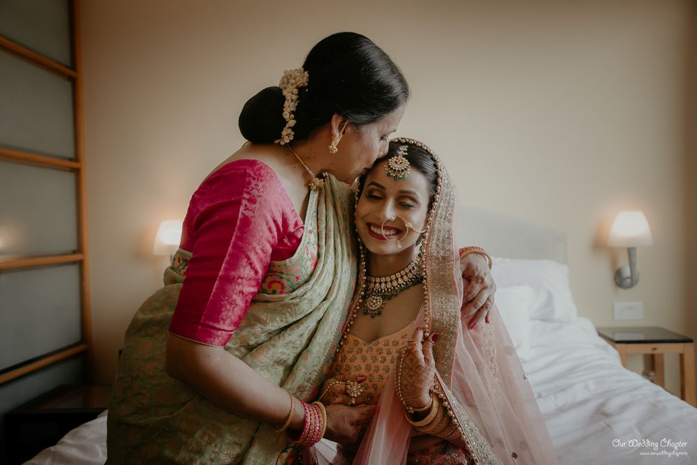 Photo of A candid shot of the bride and her mother