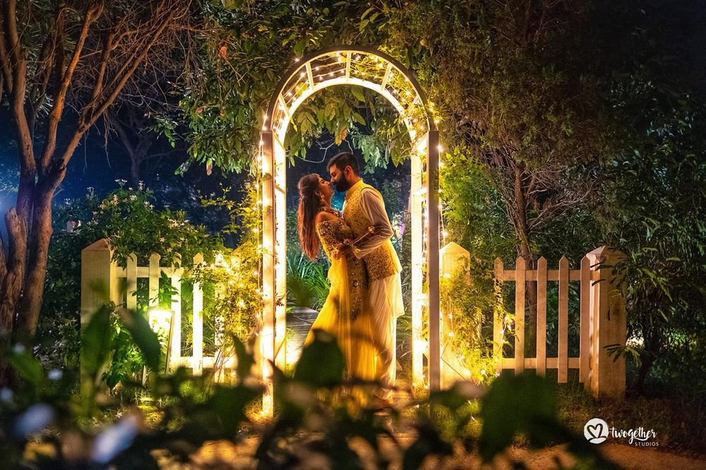 Photo of Bride and groom pose for their pre wedding shoot