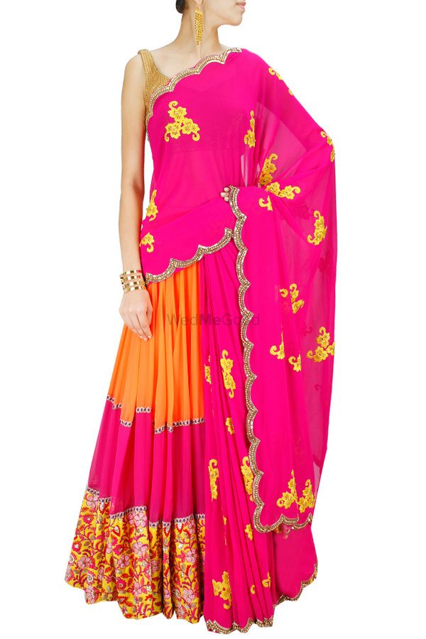 Photo of Bright pink and orange lehenga with yellow embroidery