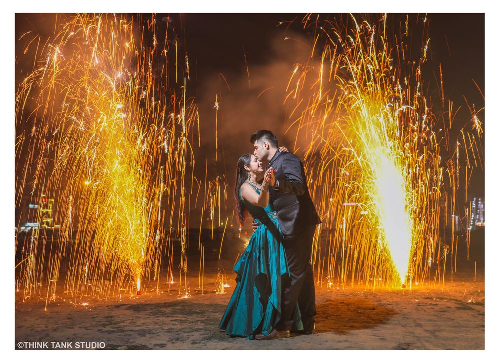 Photo of Couple shot with fire works background