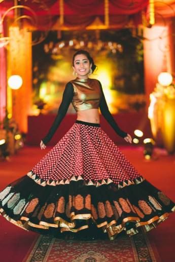 Photo of metallic gold lehenga full sleeves with printed banarsi lehenga skirt