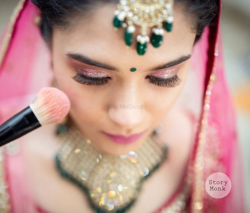 Photo of light pink smokey eye makeup with pink lehenga