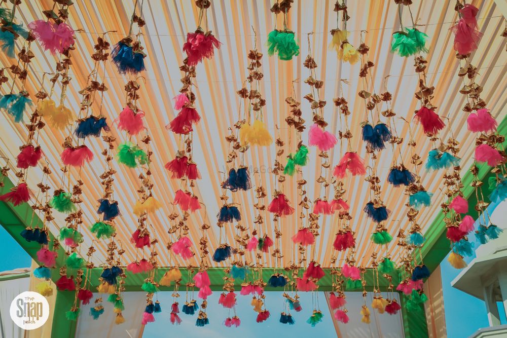 Photo of Hanging tassels for mehendi decor from tent