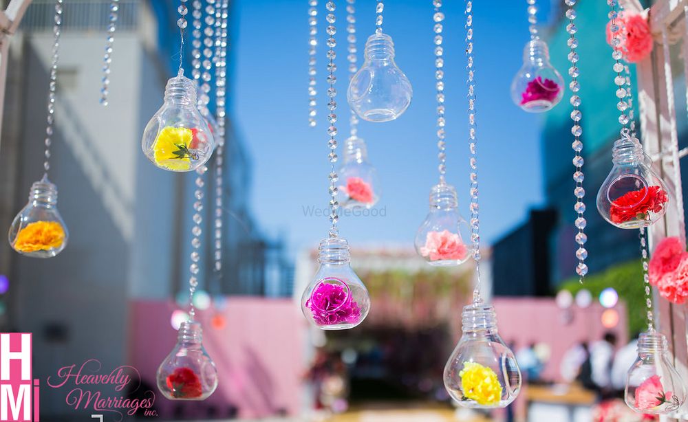 Photo of Hanging bulbs with flowers for mehendi