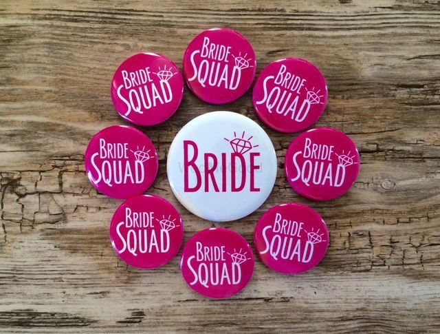 Photo of Bachelorette party badges saying girl squad