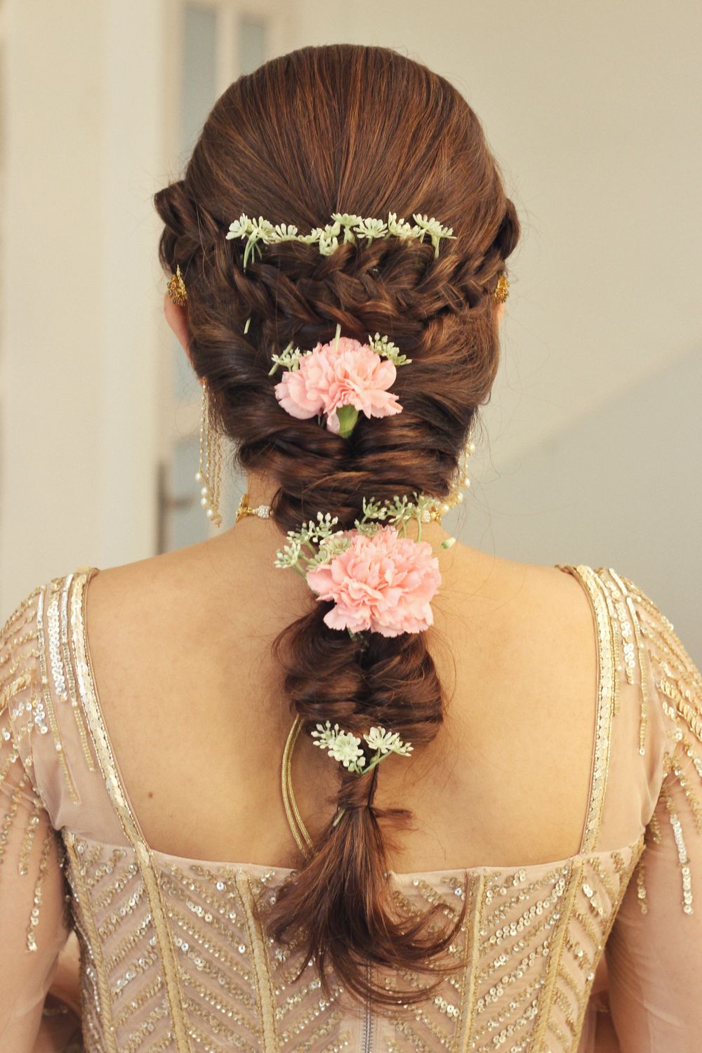 Photo of bridal or mehendi braid with carnations
