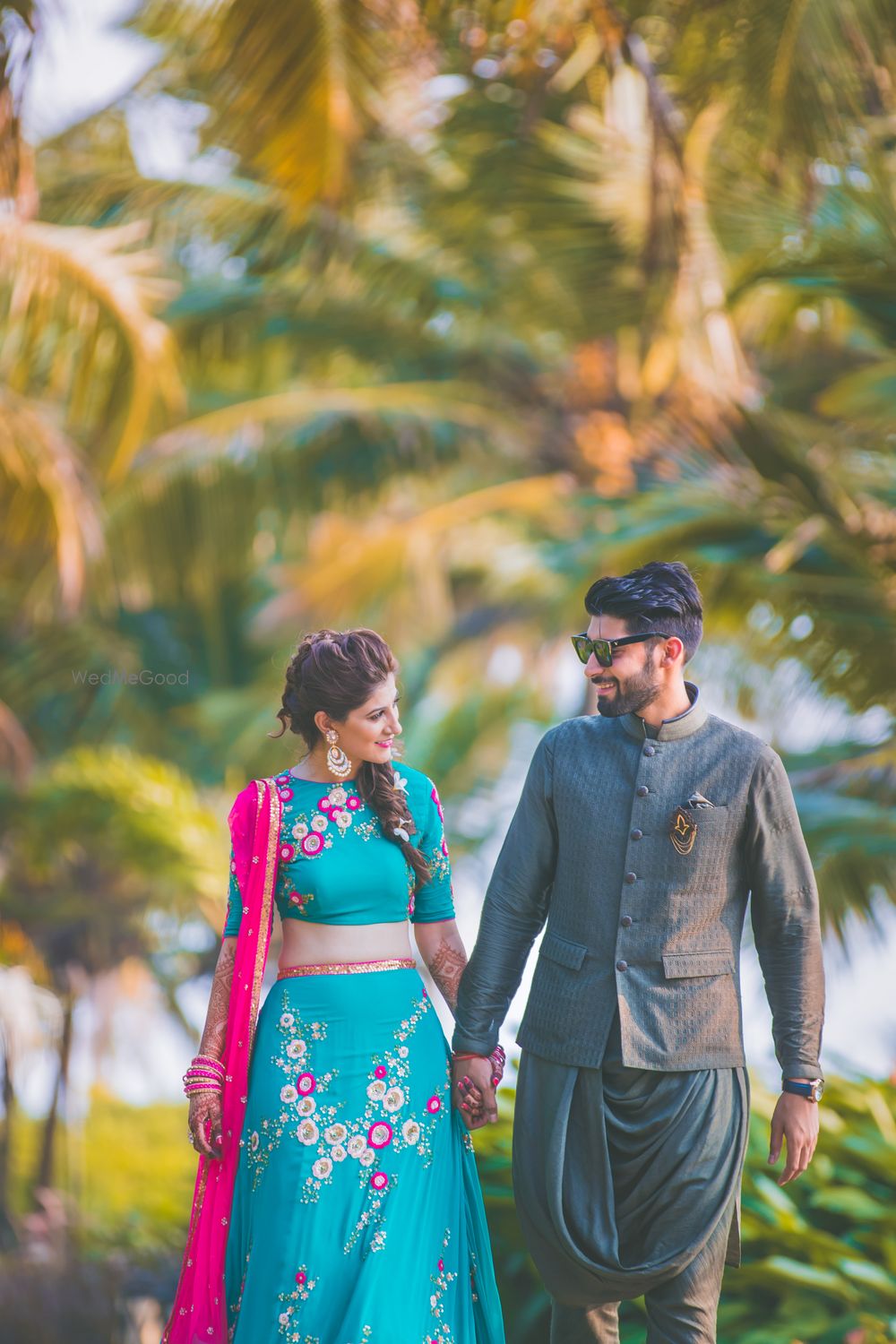 Photo of Couple mehendi portrait in trendy outfits