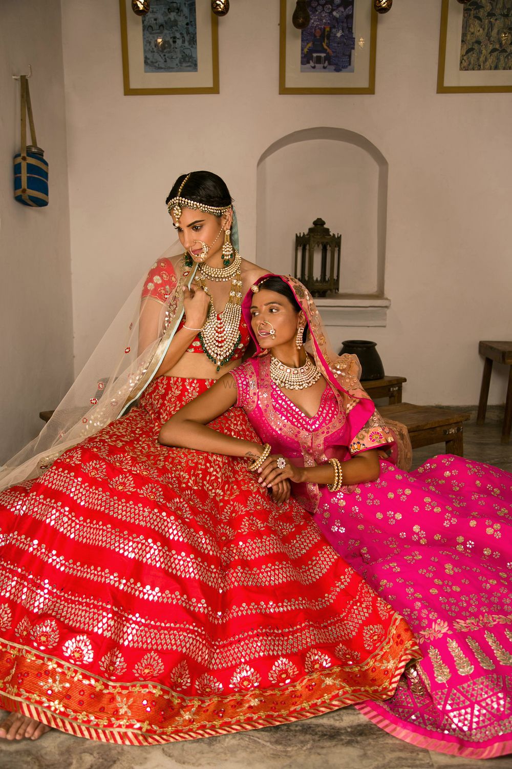 Photo of Bright red and pink sequin work bridal lehengas