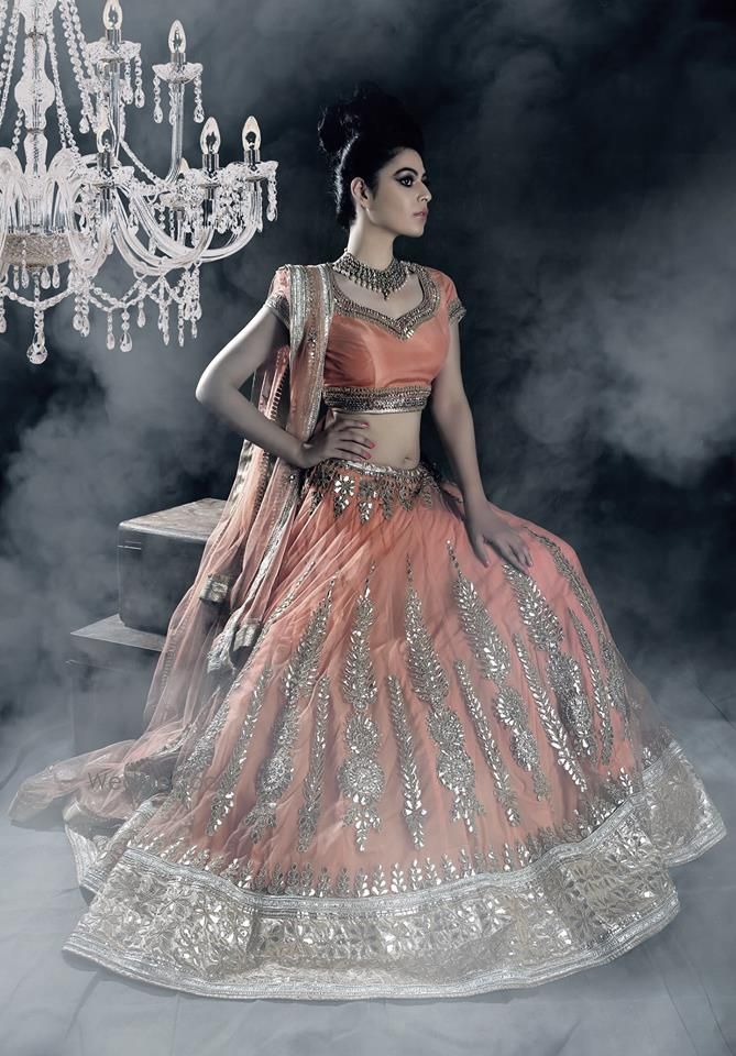 Photo of orange peach bridal lehenga with ambi