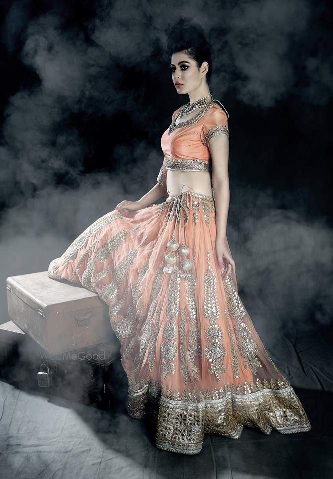 Photo of orange peach bridal lehenga with gold gota work