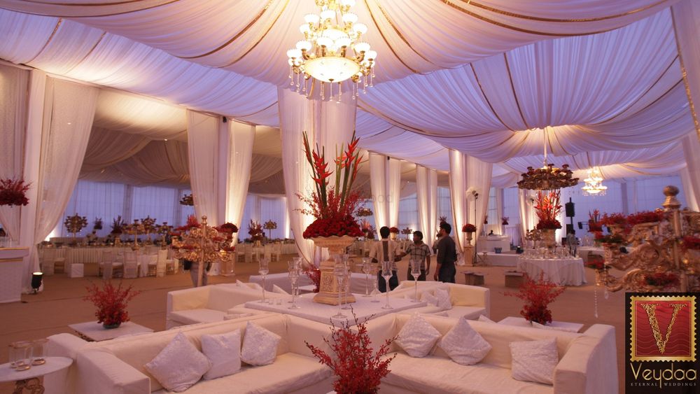 Photo of white and red theme wedding decor
