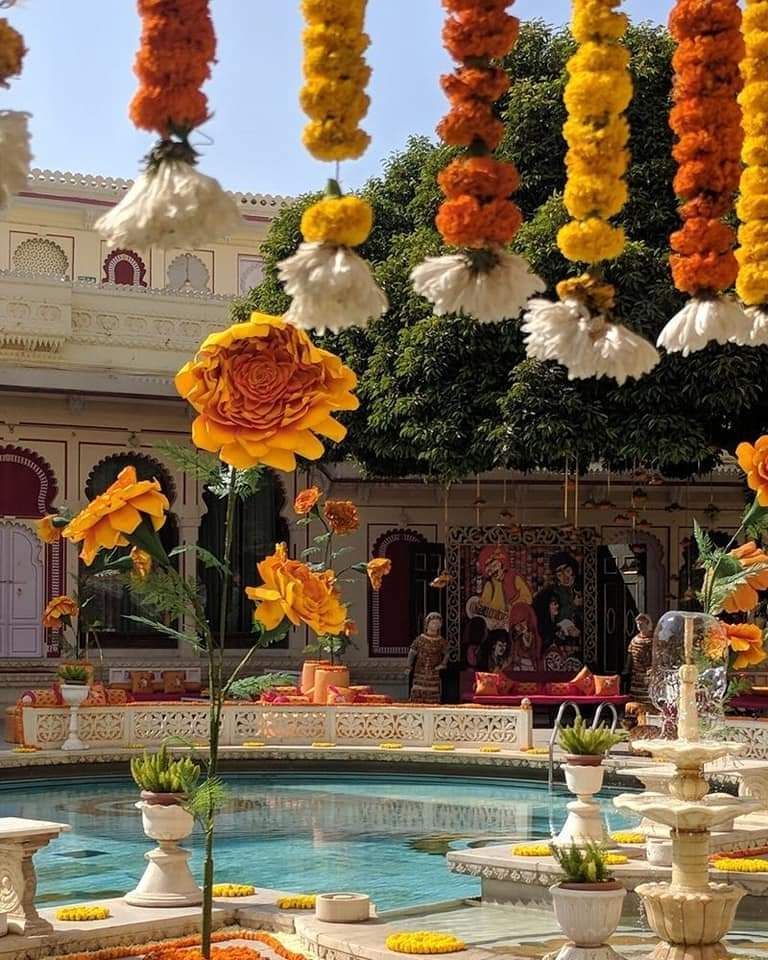 Photo of Colourful mehendi decor with marigold flowers