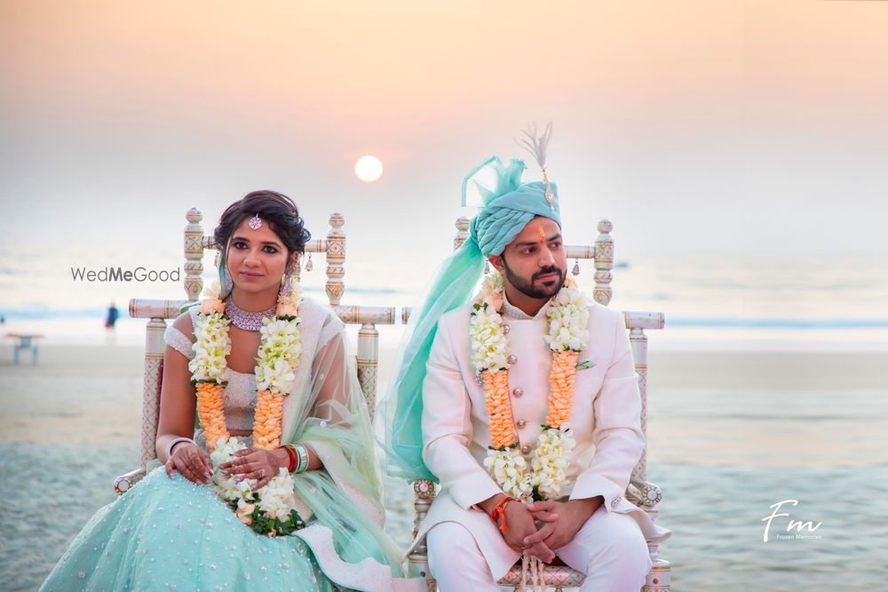 Photo of Beach wedding idea with bride and groom in light blue