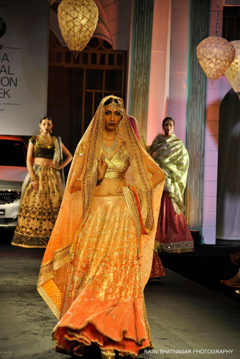Photo of ombre gold and orange and peach lehenga with metallic foil blouse and ombre sunset colored dupatta