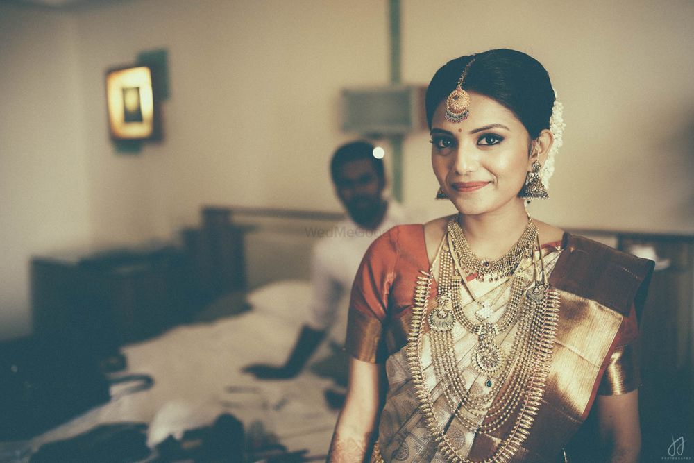 Photo of South India Bride wearing Gold Jewelry