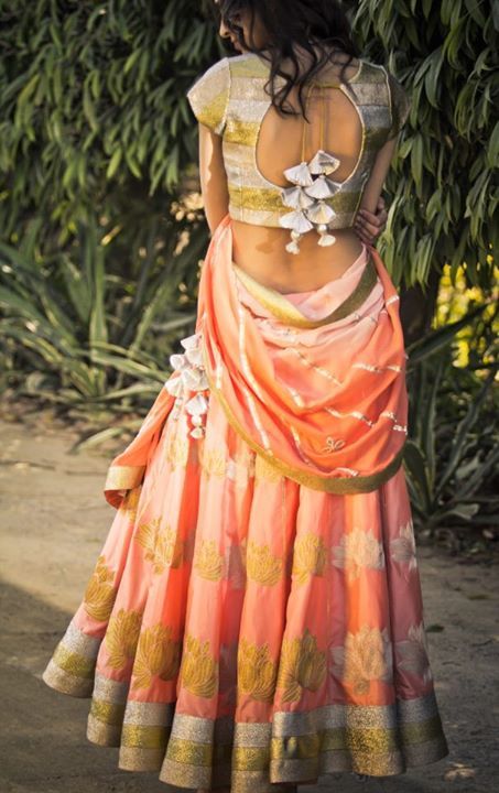 Photo of gold and peach lehenga