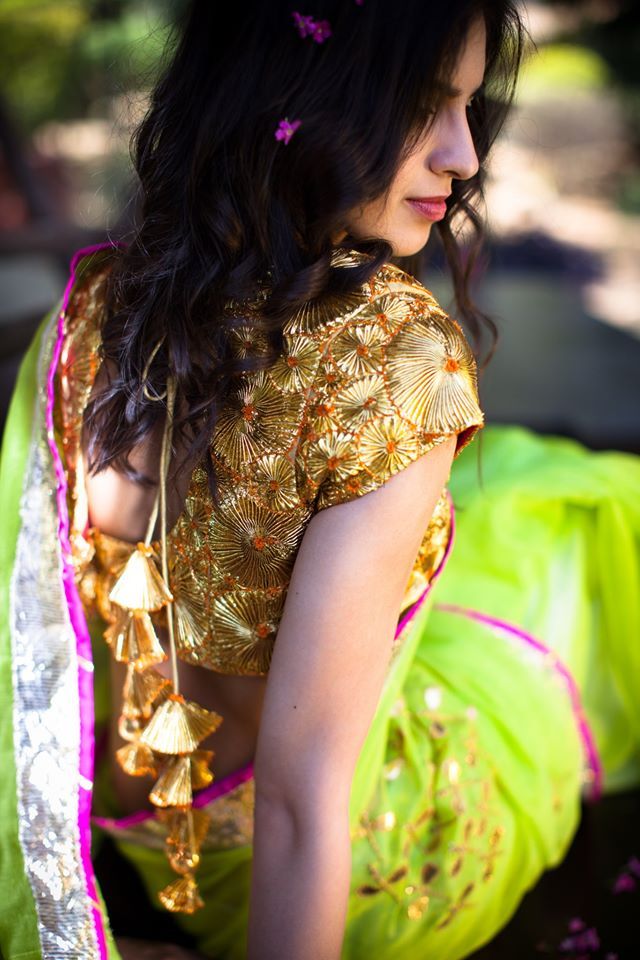 Photo of gota work blouse with lime green sari and pom pom tassles at the back