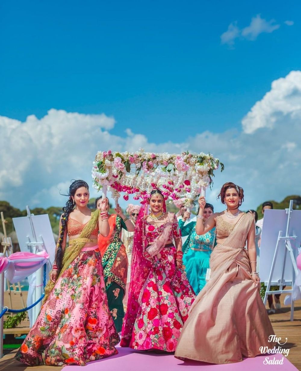 Photo of bridal entry under phoolon ki chadar with her sisters