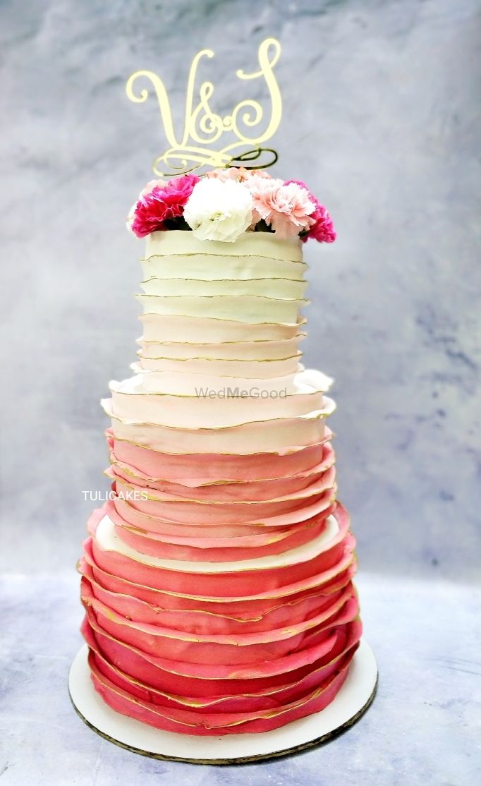 Photo of An amazing ombre three-tier cake.