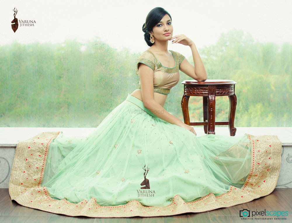 Photo of mint georgette lehenga with border and gold metallic short sleeved blouse