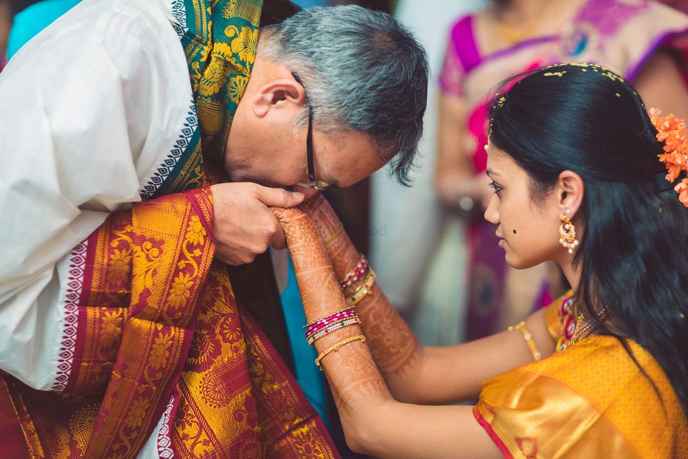 Photo of Bride with her father kissing her hands