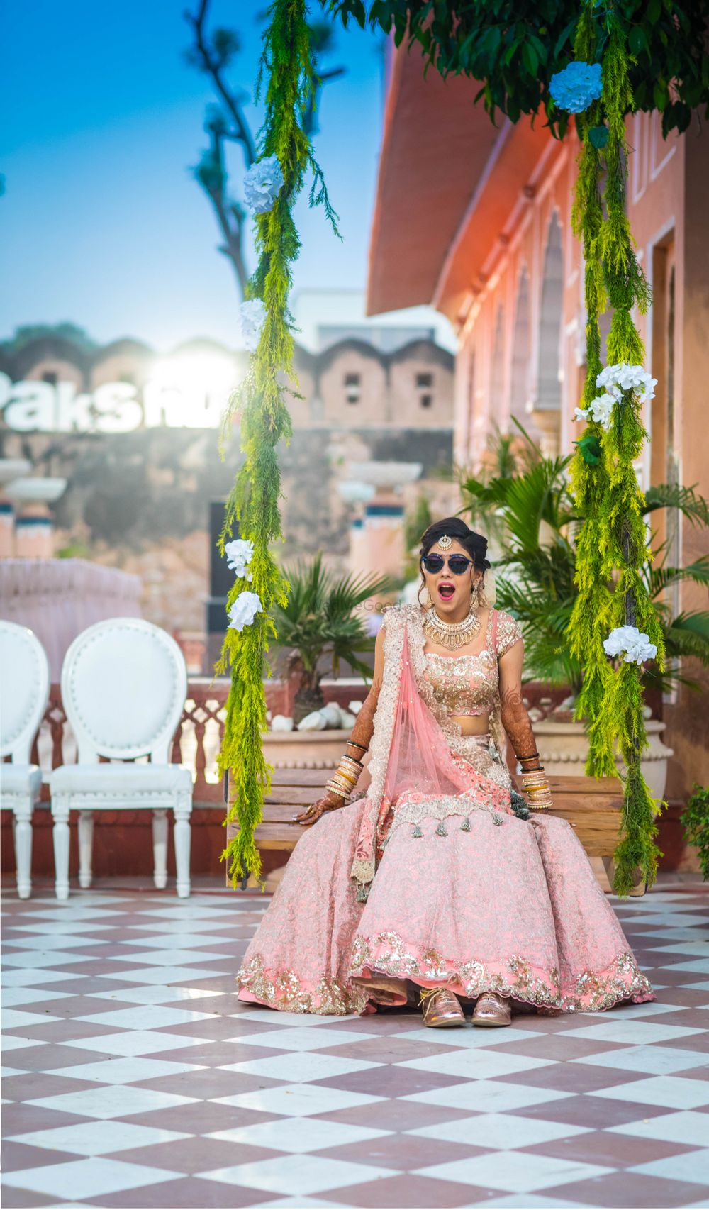 Photo of Fun bridal shot with sunnies and sneakers