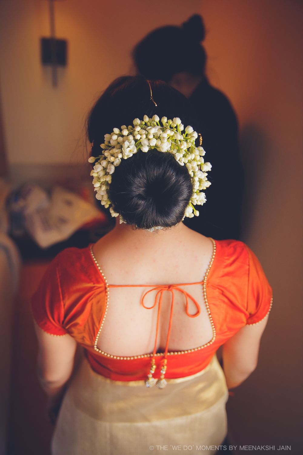 Photo of South Indian bridal blouse in orange with tie back