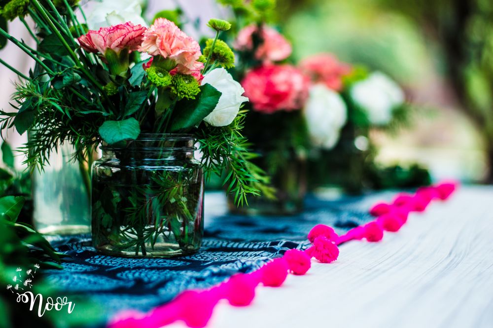 Photo of Flowers in glass jars for day decor