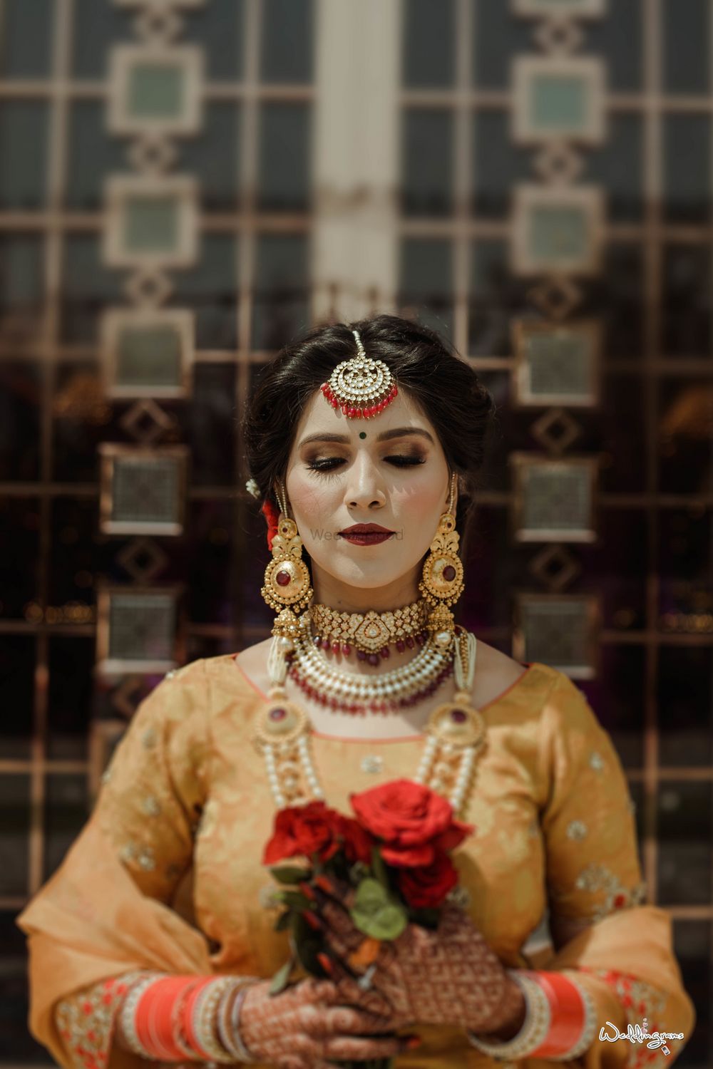 Photo of Offbeat bride with statement jewellery