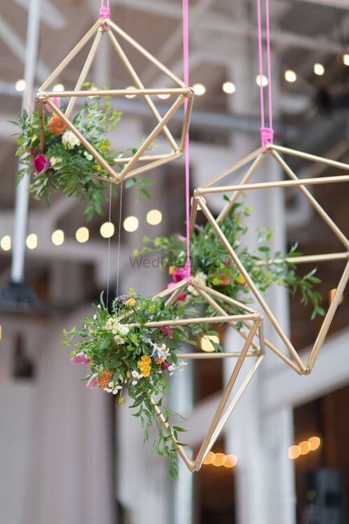 Photo of Hanging floral arrangement with wooden sticks