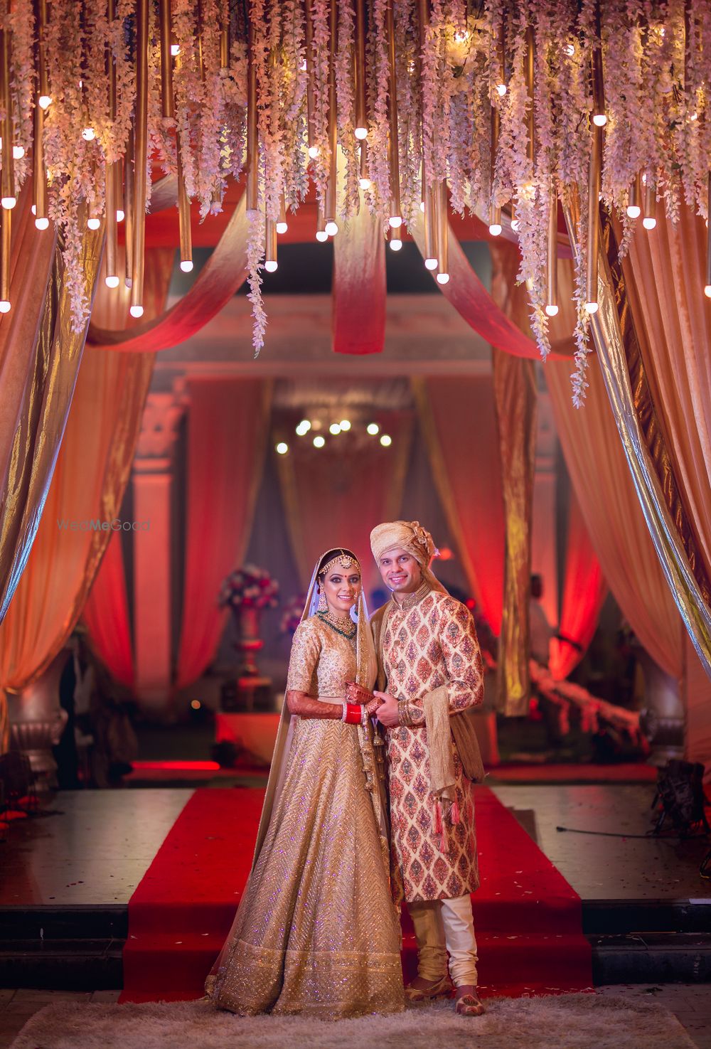 Photo of Red and gold theme couple wedding portrait