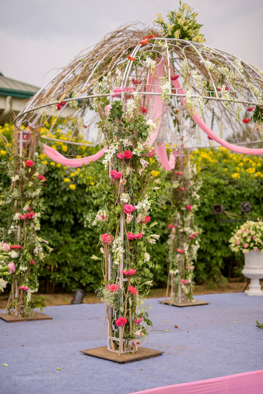 Photo of White Mandap with White and Pink Floral Decor