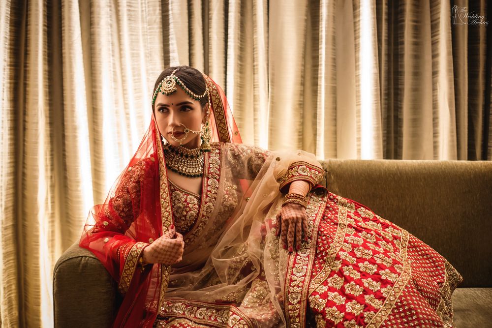 Photo of A bride in red and gold