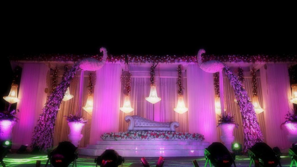 Photo of all white stage decor