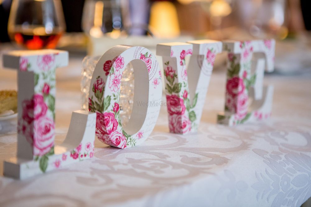 Photo of Love wooden block decor with florals