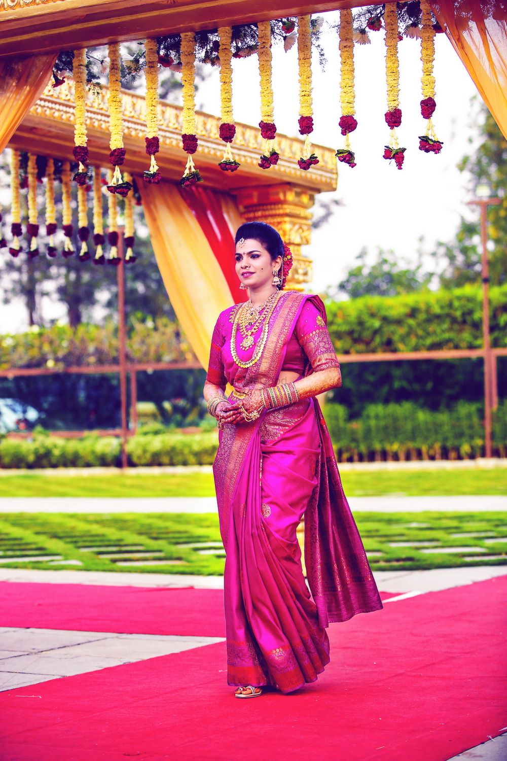 Photo of A south Indian bride in a pink kanjeevaram for the wedding day