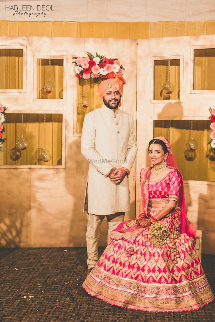 Photo of Sikh Bride in Bright Pink and Gold Zig Zag Lehenga