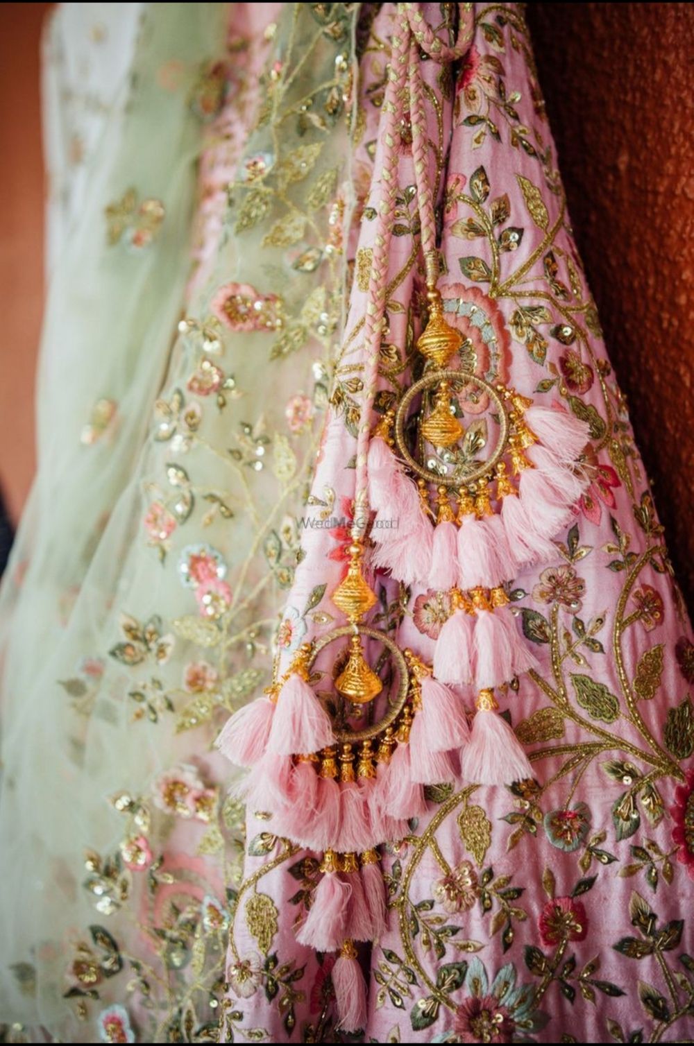 Photo of Pretty pink andgold bridal latkans for an Indian wedding