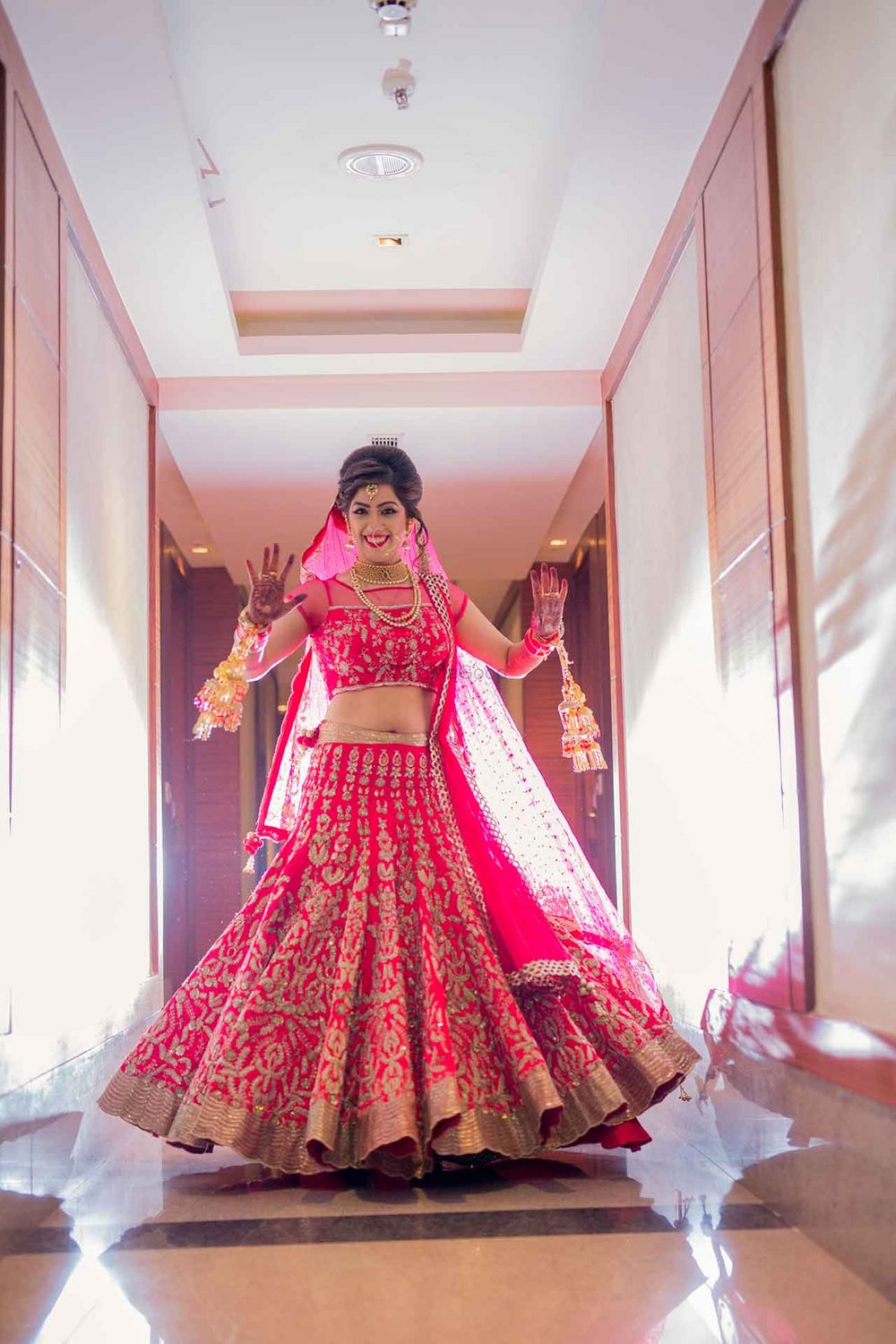 Photo of Bride in Pink and Gold Bridal Lehenga with Kaleere