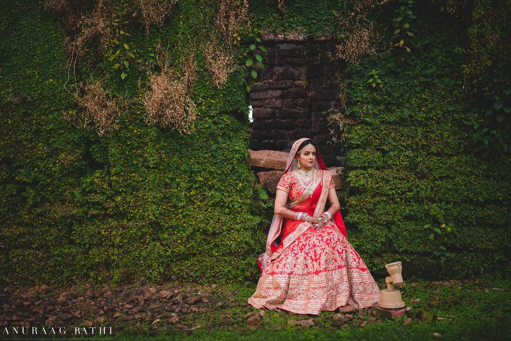 Photo of Bridal portrait in pink against botanical wall