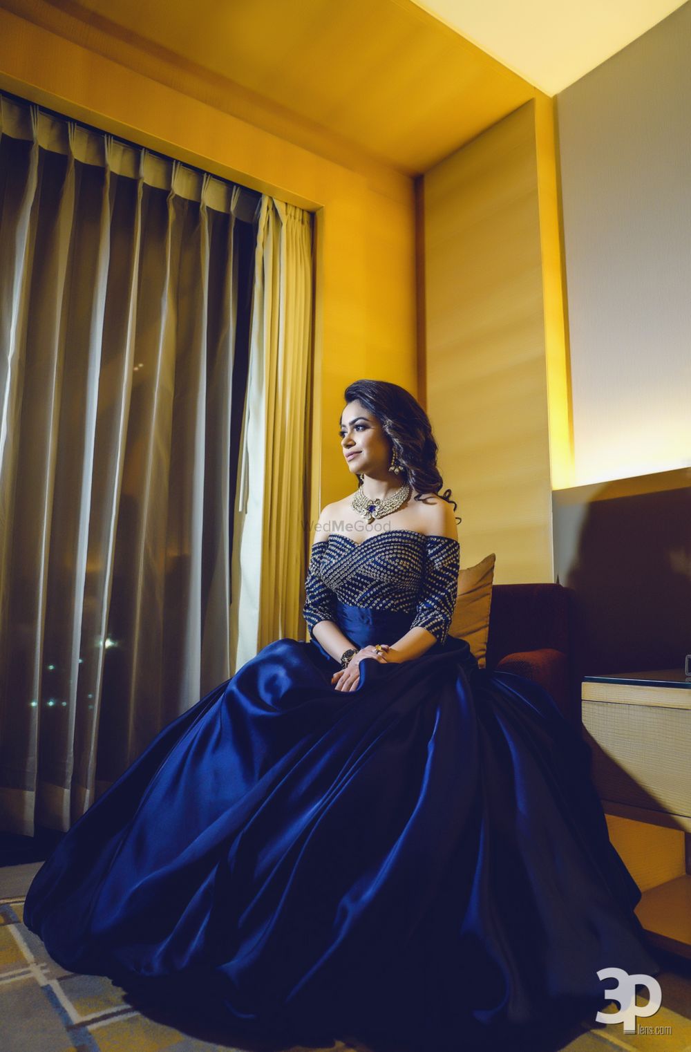 Photo of Navy blue flared off shoulder gown