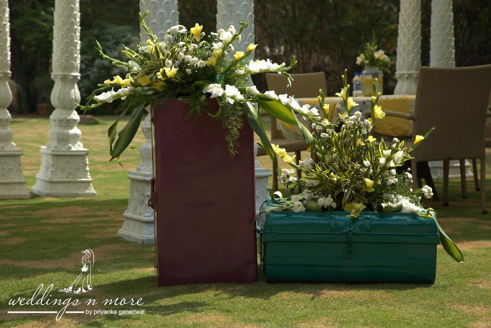 Photo of Trunks with floral arrangements in decor